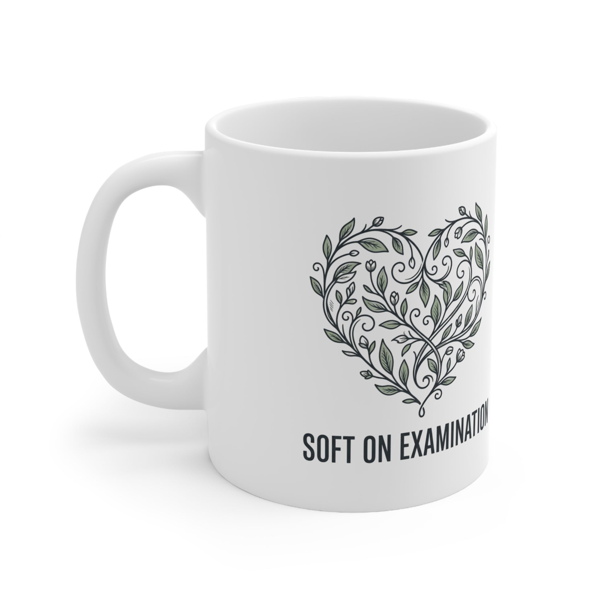 Close-up of the bold print design on the 'Soft on Examination' coffee mug